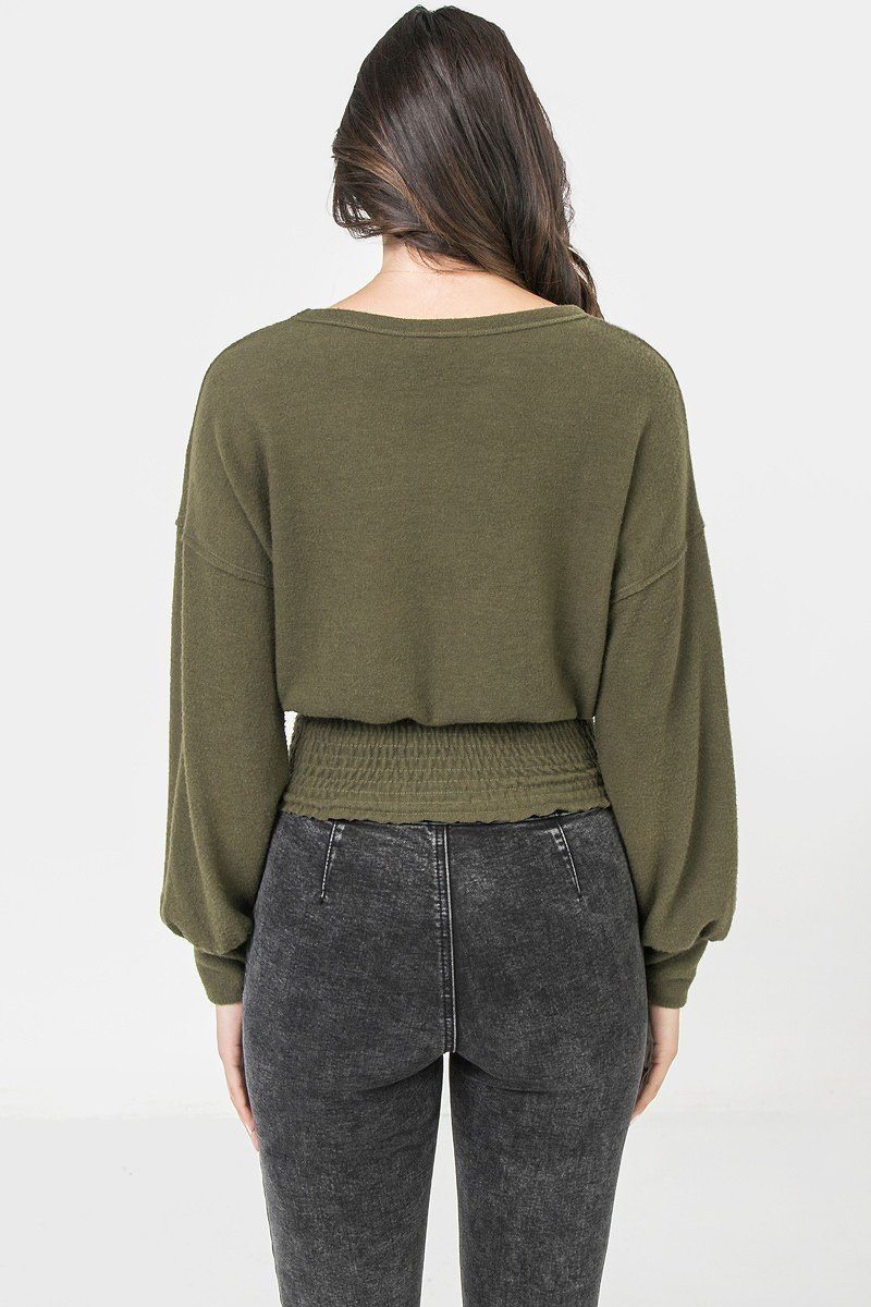 A Knit Top Featuring Wide Neckline